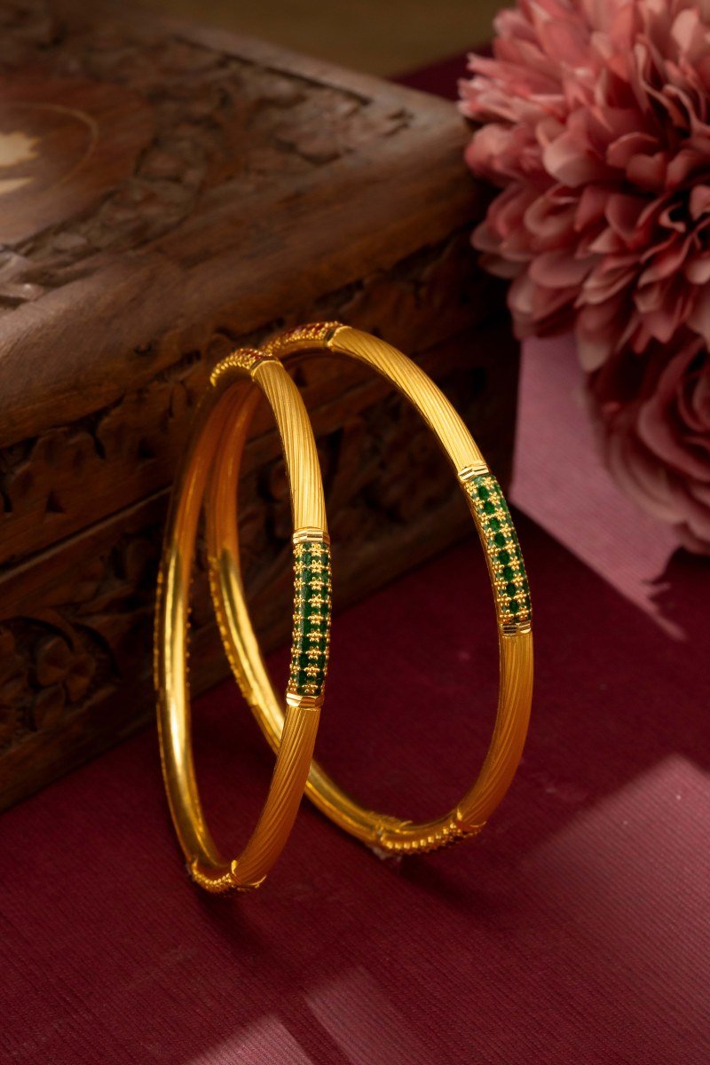 Pair of 22K 916 HUID Hallmarked Gold Bangles with fine green Meenakari detailing at A P Jewellers Prantij