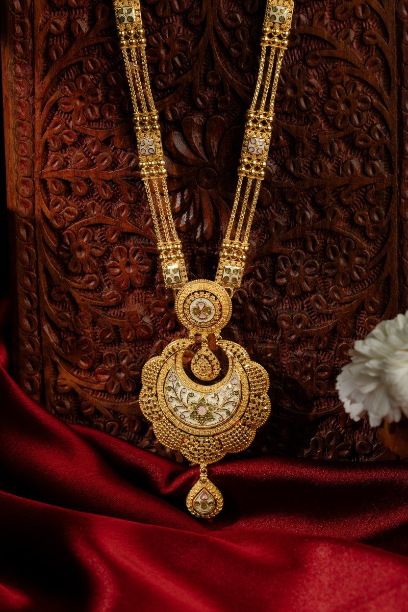 Handcrafted 22K Gold Chandbali Motif Long Haar displayed on carved heritage wood at A P Jewellers Prantij