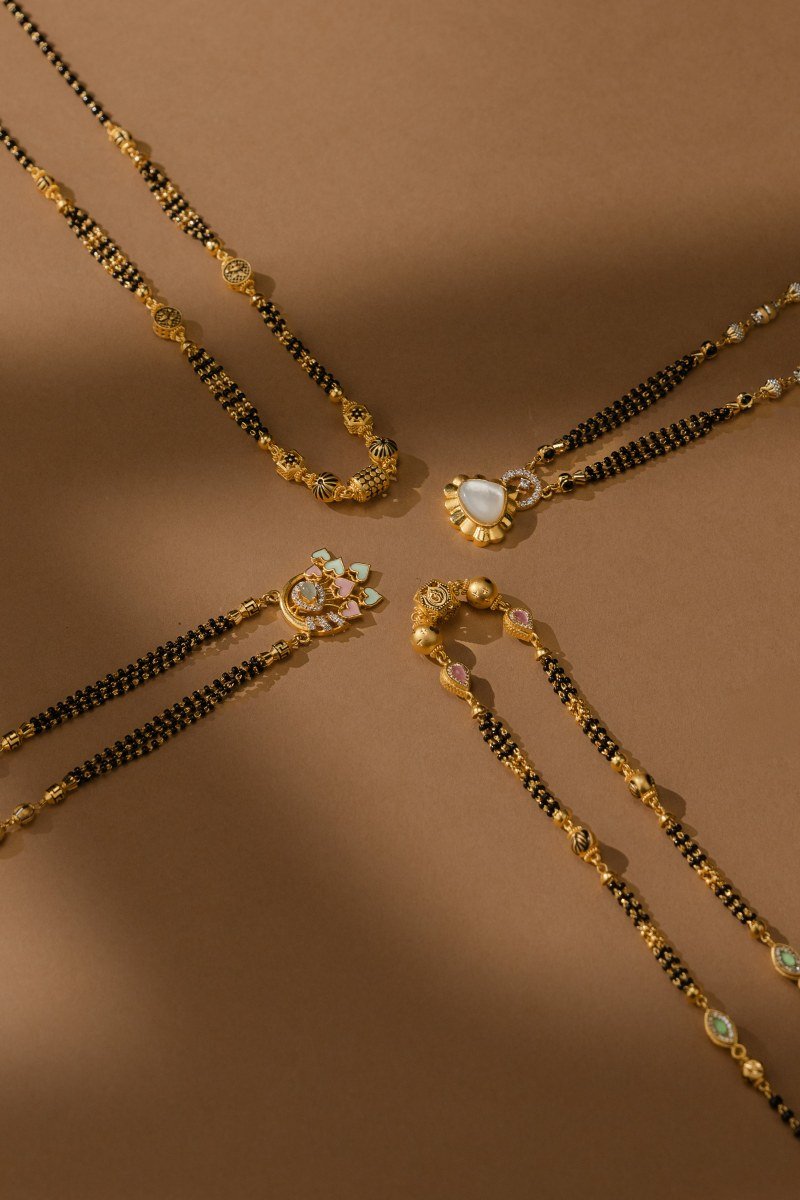 Four 22K Gold Mangalsutra designs with floral, heart and enamel pendants at A P Jewellers Prantij