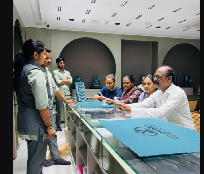 Relationship managers assisting customer family in showroom
